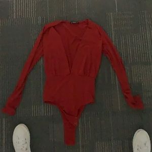 Low cut red body suit